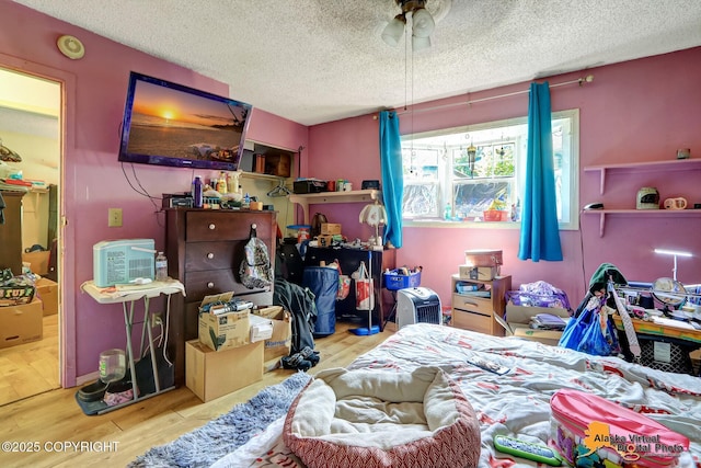 7510 Peck Ave, Anchorage, AK 99504 - bedroom featuring wood finished floors and a textured ceiling