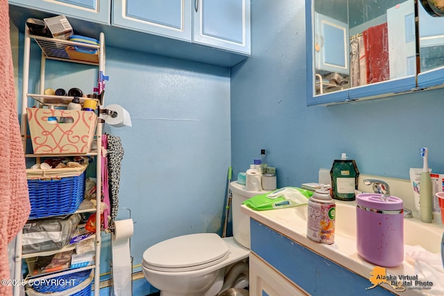 7510 Peck Ave, Anchorage, AK 99504 - bathroom featuring toilet and vanity
