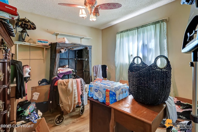 7510 Peck Ave, Anchorage, AK 99504 - bedroom with a textured ceiling, wood finished floors, and ceiling fan