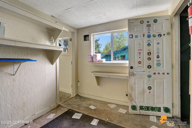 7510 Peck Ave, Anchorage, AK 99504 - misc room featuring baseboards and a paneled ceiling