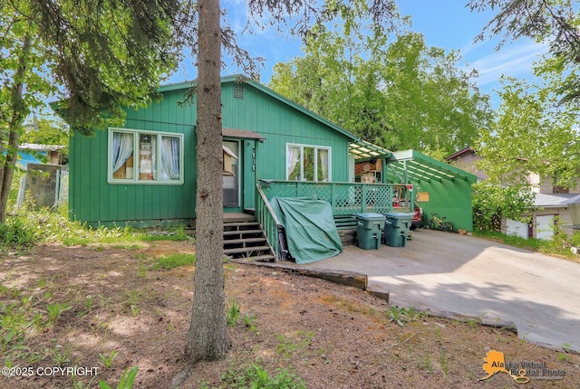 7510 Peck Ave, Anchorage, AK 99504 - rear view of house with a deck