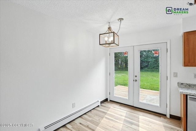 1918 Juneau Dr, Anchorage, AK 99501 - unfurnished dining area featuring french doors, baseboard heating, healthy amount of natural light, light wood-style flooring, and a textured ceiling