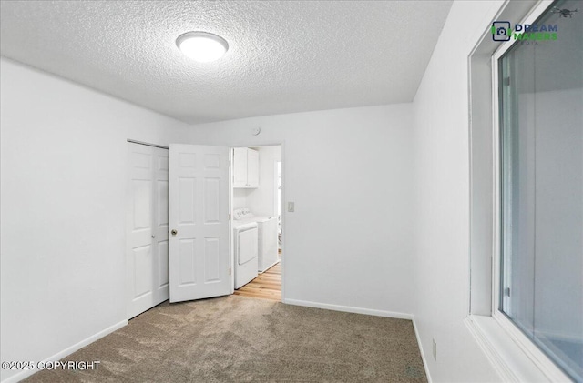 1918 Juneau Dr, Anchorage, AK 99501 - unfurnished bedroom with independent washer and dryer, light carpet, a textured ceiling, and a closet