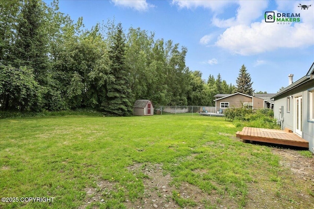1918 Juneau Dr, Anchorage, AK 99501 - view of yard with a storage shed and a deck