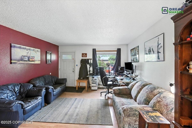 1918 Juneau Dr, Anchorage, AK 99501 - living room with a desk, a textured ceiling, wood finished floors, and a textured wall