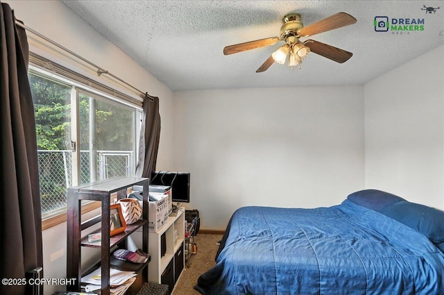 1918 Juneau Dr, Anchorage, AK 99501 - carpeted bedroom featuring ceiling fan and a textured ceiling