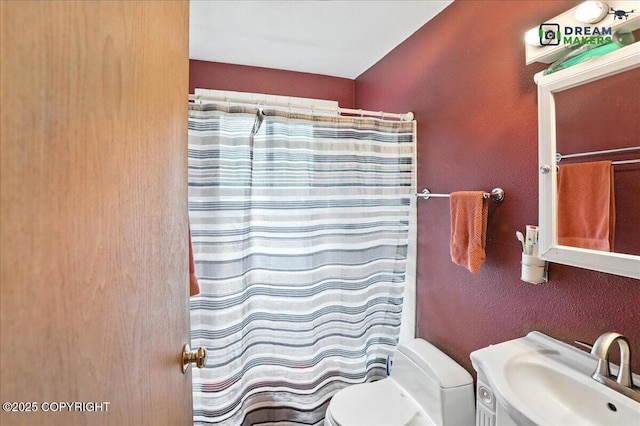 1918 Juneau Dr, Anchorage, AK 99501 - full bath featuring a textured wall and a shower with shower curtain
