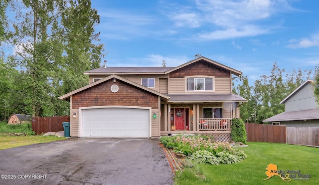 18924 Third St, Eagle River, AK 99577 - view of front of home with covered porch, asphalt driveway, and an attached garage