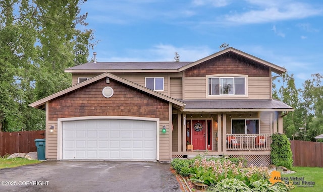 18924 Third St, Eagle River, AK 99577 - view of front of home with covered porch, asphalt driveway, a garage, and a shingled roof
