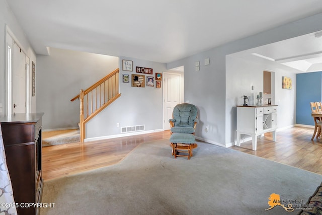 18924 Third St, Eagle River, AK 99577 - living area featuring stairway and wood finished floors