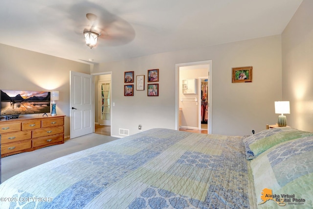 18924 Third St, Eagle River, AK 99577 - bedroom featuring a spacious closet, carpet floors, and a ceiling fan