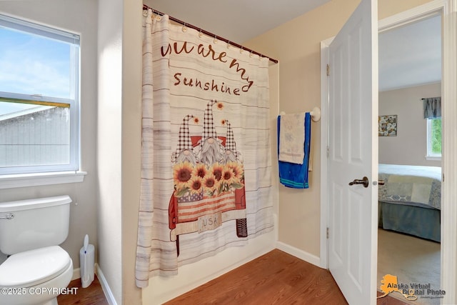 18924 Third St, Eagle River, AK 99577 - bathroom featuring connected bathroom and wood finished floors