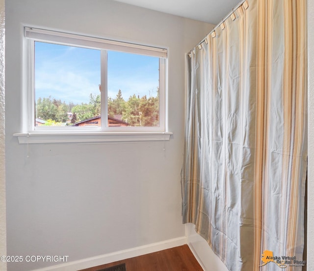18924 Third St, Eagle River, AK 99577 - bathroom with baseboards and wood finished floors