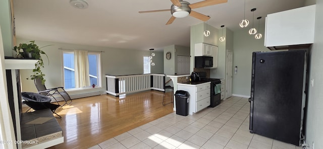 6905 Cape Lisburne Loop, Anchorage, AK 99504 - kitchen featuring black appliances, white cabinets, a ceiling fan, vaulted ceiling, and light tile patterned flooring