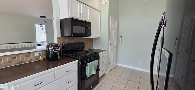 6905 Cape Lisburne Loop, Anchorage, AK 99504 - kitchen with black appliances, dark countertops, backsplash, and light tile patterned floors