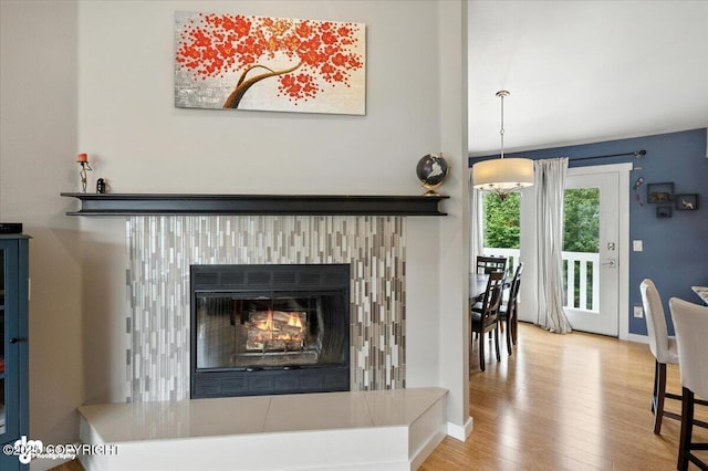 8968 Little Brook St, Anchorage, AK 99507 - detailed view of wood finished floors and a glass covered fireplace
