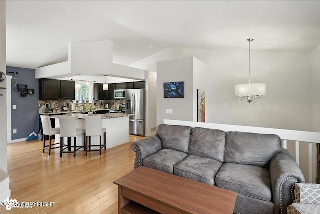 8968 Little Brook St, Anchorage, AK 99507 - living room with light wood-style flooring and lofted ceiling