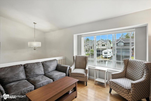 8968 Little Brook St, Anchorage, AK 99507 - living area featuring light wood-type flooring and lofted ceiling