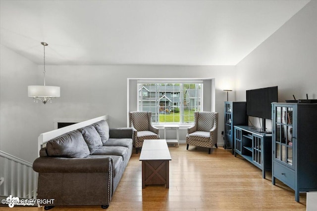 8968 Little Brook St, Anchorage, AK 99507 - living area with light wood-style flooring and a chandelier