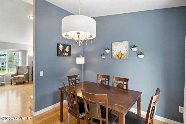 8968 Little Brook St, Anchorage, AK 99507 - dining area featuring light wood finished floors and vaulted ceiling