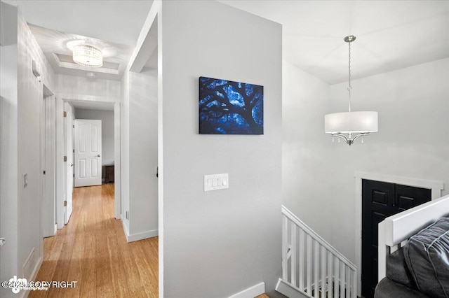 8968 Little Brook St, Anchorage, AK 99507 - corridor with an upstairs landing and light wood-style floors