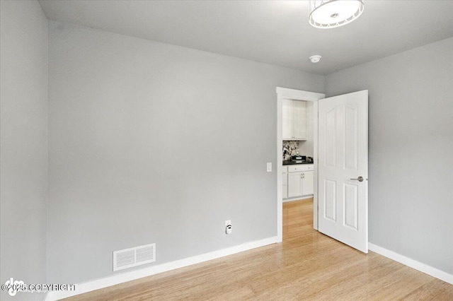8968 Little Brook St, Anchorage, AK 99507 - spare room with light wood-style floors and a smoke detector
