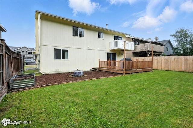 8968 Little Brook St, Anchorage, AK 99507 - back of house featuring a fenced backyard and a balcony