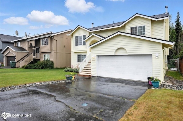8968 Little Brook St, Anchorage, AK 99507 - view of front of house with asphalt driveway, stairs, a garage, and a shingled roof