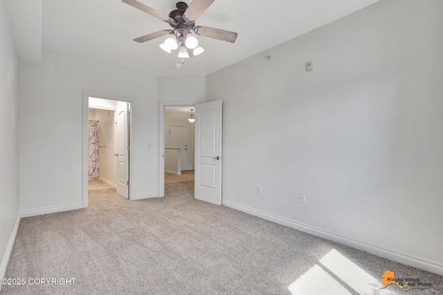 6942 Meadow St # 2-305, Anchorage, AK 99507 - unfurnished bedroom with light carpet, baseboards, a ceiling fan, and ensuite bathroom