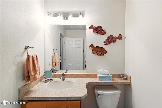 48585 Runners Ave, Soldotna, AK 99669 - bathroom with vanity and toilet