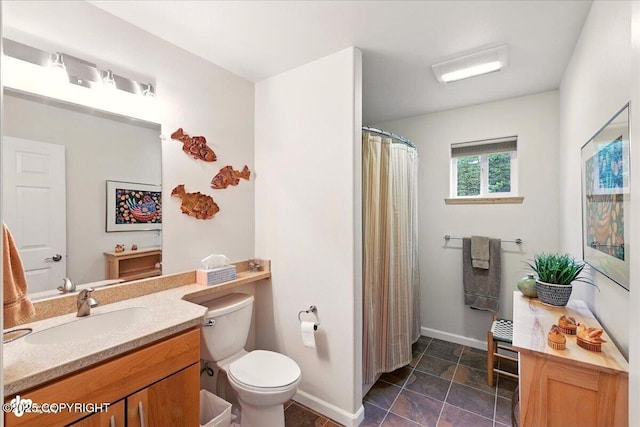 48585 Runners Ave, Soldotna, AK 99669 - full bath with toilet, vanity, baseboards, and a shower with shower curtain