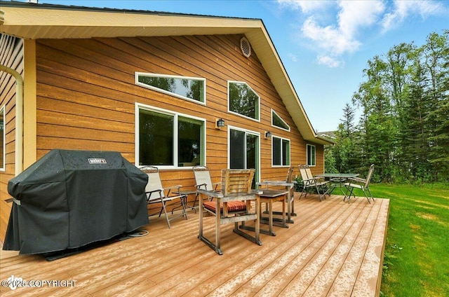 48585 Runners Ave, Soldotna, AK 99669 - wooden terrace featuring outdoor dining area, area for grilling, and a lawn