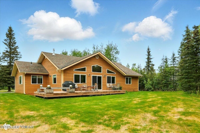 48585 Runners Ave, Soldotna, AK 99669 - rear view of property featuring a lawn and a deck