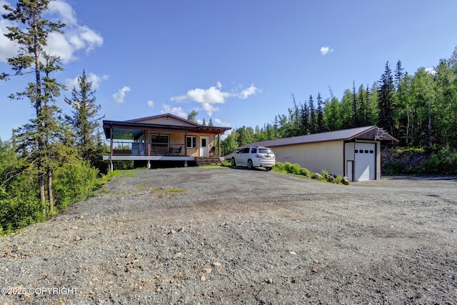 9291 Basher Dr, Anchorage, AK 99507 - view of front of property featuring covered porch and an outbuilding