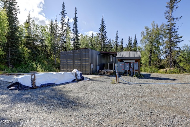 9291 Basher Dr, Anchorage, AK 99507 - rear view of property featuring metal roof