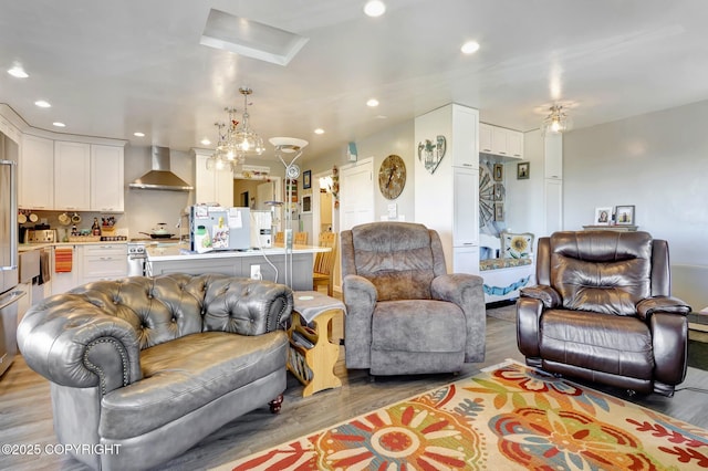 9291 Basher Dr, Anchorage, AK 99507 - living room with light wood-style floors, recessed lighting, and a chandelier
