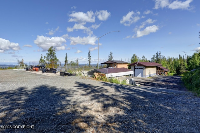 9291 Basher Dr, Anchorage, AK 99507 - view of dirt / gravel road featuring street lights
