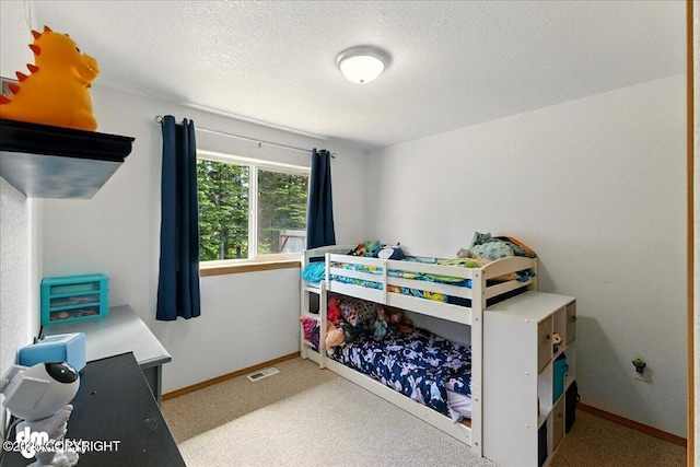 1213 Channel Way, Kenai, AK 99611 - carpeted bedroom featuring a textured ceiling
