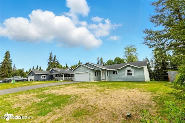 1213 Channel Way, Kenai, AK 99611 - ranch-style house with an attached garage, asphalt driveway, and a front yard