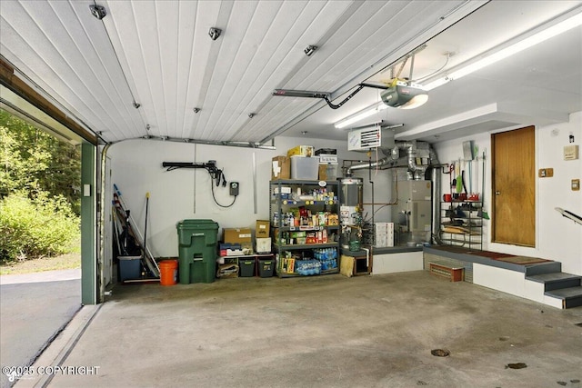 5420 E 112th Ave, Anchorage, AK 99516 - garage featuring a garage door opener, water heater, and a heating unit