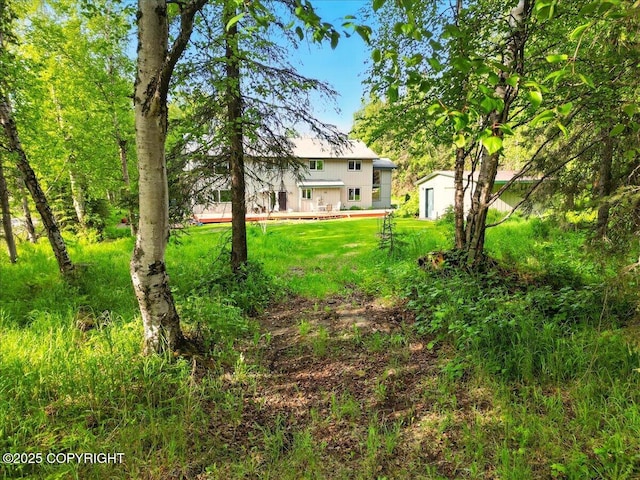 5420 E 112th Ave, Anchorage, AK 99516 - view of green lawn featuring a deck
