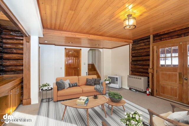 40327 S Malaspina Loop, Talkeetna, AK 99676 - carpeted living area with rustic walls, heating unit, stairs, wood ceiling, and baseboards
