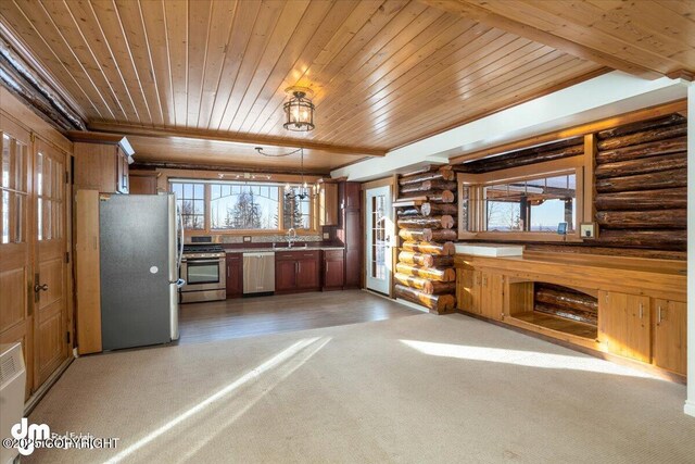 40327 S Malaspina Loop, Talkeetna, AK 99676 - kitchen with stainless steel appliances, wooden ceiling, log walls, light carpet, and hanging light fixtures