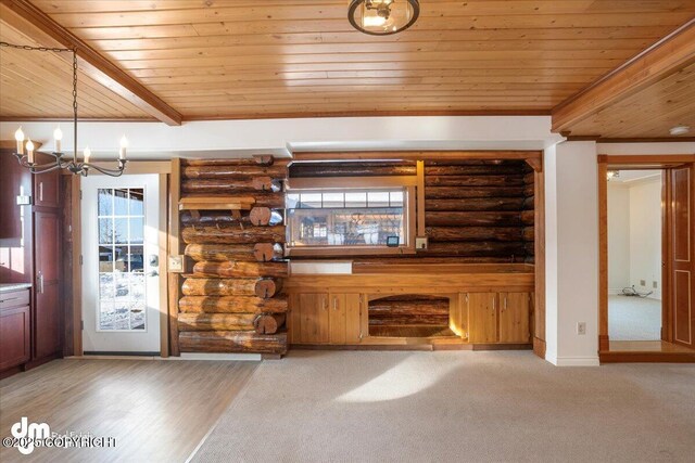 40327 S Malaspina Loop, Talkeetna, AK 99676 - unfurnished living room featuring wood ceiling, rustic walls, a chandelier, and baseboards