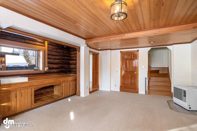 40327 S Malaspina Loop, Talkeetna, AK 99676 - unfurnished living room featuring heating unit, wooden ceiling, rustic walls, stairway, and carpet flooring