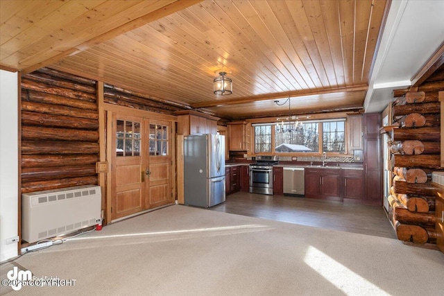 40327 S Malaspina Loop, Talkeetna, AK 99676 - kitchen with appliances with stainless steel finishes, wood ceiling, rustic walls, a sink, and dark carpet