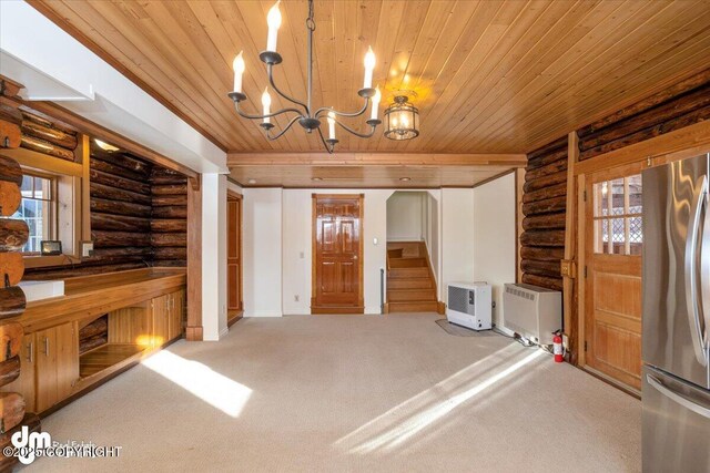 40327 S Malaspina Loop, Talkeetna, AK 99676 - unfurnished living room with rustic walls, wood ceiling, a chandelier, stairway, and carpet
