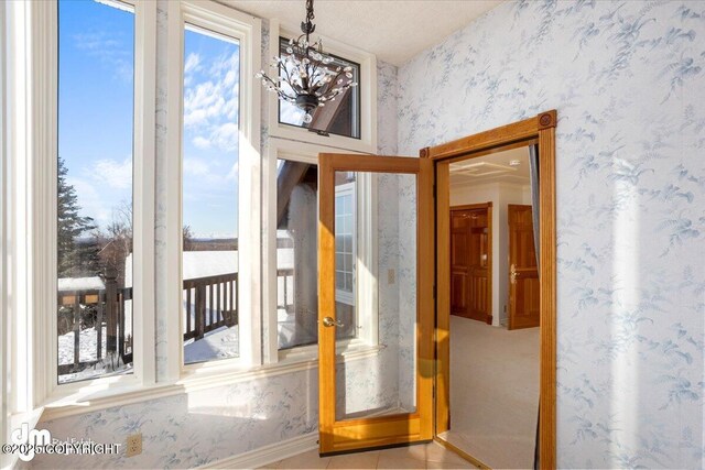 40327 S Malaspina Loop, Talkeetna, AK 99676 - entryway with wallpapered walls and a chandelier