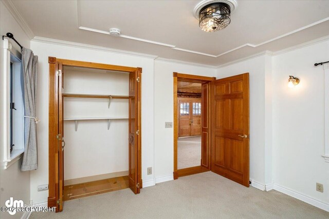 40327 S Malaspina Loop, Talkeetna, AK 99676 - unfurnished bedroom featuring light colored carpet, ornamental molding, a closet, and baseboards