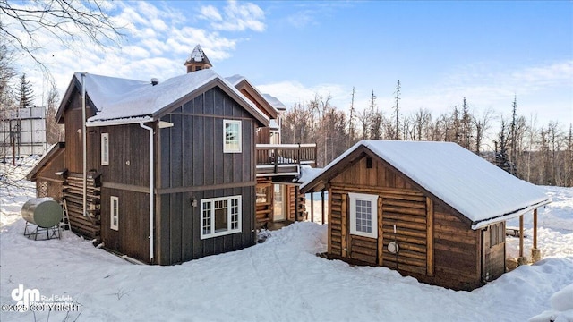 40327 S Malaspina Loop, Talkeetna, AK 99676 - view of snowy exterior with board and batten siding
